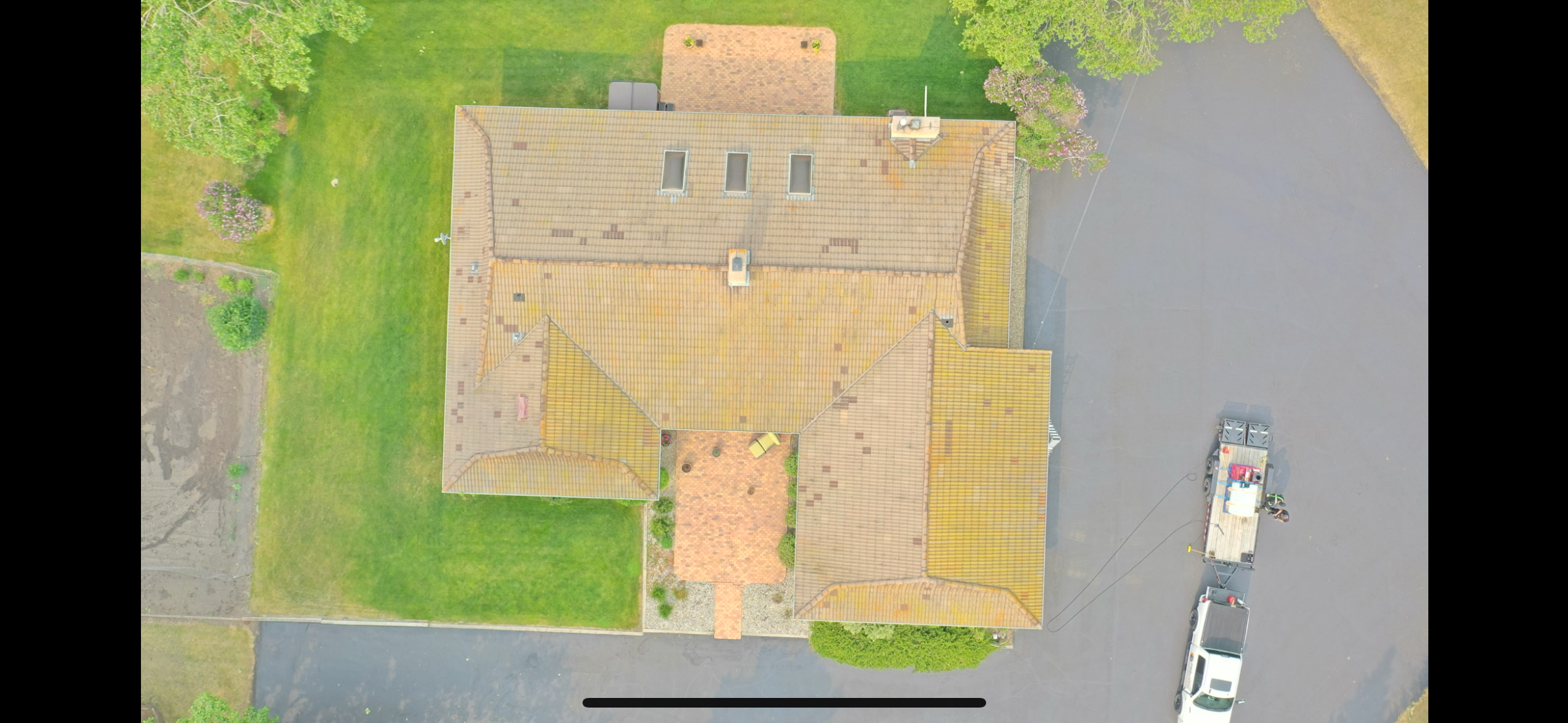 Concrete tile roof before cleaning in Olds, AB